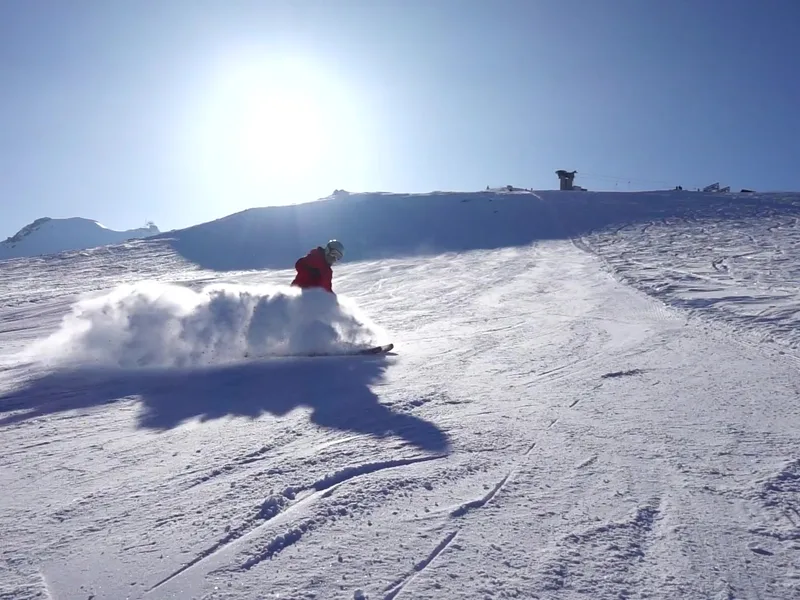 A skier in powder snow